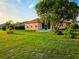 Well-manicured lawn with mature trees and lush landscaping at 834 Springwood Cir, Bradenton, FL 34212