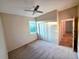 Comfortable bedroom featuring carpet, a ceiling fan and a closet with bi-fold doors at 834 Springwood Cir, Bradenton, FL 34212