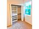 Bright bedroom closet with shelving and rod for ample storage at 834 Springwood Cir, Bradenton, FL 34212