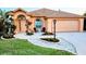 Charming home featuring a manicured front yard with stone accents and welcoming curb appeal at 834 Springwood Cir, Bradenton, FL 34212