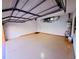 Spacious garage with epoxy flooring, water heater, and ample lighting at 834 Springwood Cir, Bradenton, FL 34212