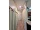 Hallway with wood-look flooring, closet and a view of the kitchen at 834 Springwood Cir, Bradenton, FL 34212