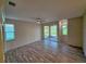 Open and bright living room with modern flooring and large windows with views of the golf course at 834 Springwood Cir, Bradenton, FL 34212