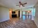 Bright and airy living room featuring modern floors, high ceilings and a welcoming view of the entry at 834 Springwood Cir, Bradenton, FL 34212