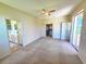 Spacious bedroom with carpet, ceiling fan, and ensuite bathroom at 834 Springwood Cir, Bradenton, FL 34212