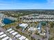 Expansive aerial view of the community featuring a lake, pool, tennis, and more at 842 Jolanda Cir, Venice, FL 34285