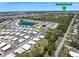 Neighborhood aerial view showcasing the community near Venice Beach and a nearby pond, offering a desirable location at 842 Jolanda Cir, Venice, FL 34285