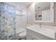 Cozy bathroom with a tub/shower combo, nautical-themed curtain, updated vanity, and a decorative seashell accent at 842 Jolanda Cir, Venice, FL 34285