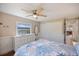 Bedroom featuring a ceiling fan, large closet and natural light from the window, creating a comfortable space at 842 Jolanda Cir, Venice, FL 34285