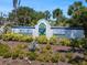 Entrance sign to Venice Isle, a 55+ residential community, surrounded by manicured landscaping at 842 Jolanda Cir, Venice, FL 34285