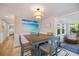 Charming dining area with coastal decor, bay window, and comfortable seating at 842 Jolanda Cir, Venice, FL 34285