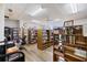 Bright library space with bookshelves, a large selection of reading materials, and a cozy reading area at 842 Jolanda Cir, Venice, FL 34285
