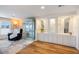 Bright living room featuring built-in display cabinets and comfortable armchair at 842 Jolanda Cir, Venice, FL 34285