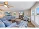 Spacious living room with neutral tones, comfortable sofas, and decorative touches at 842 Jolanda Cir, Venice, FL 34285