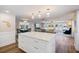 Bright, open-concept living room with modern kitchen island and stylish furnishings at 842 Jolanda Cir, Venice, FL 34285