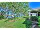 Well-maintained lawn with view of lake at 9022 Coachman Dr, Venice, FL 34293