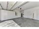 Spacious garage with built-in cabinets, ample storage, and epoxy floor at 9022 Coachman Dr, Venice, FL 34293