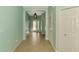 Inviting home hallway with tile flooring, leading to a bright entryway at 9022 Coachman Dr, Venice, FL 34293