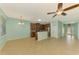 Bright, eat-in kitchen with tile floor, brown cabinets, stainless appliances, and an eat-in breakfast nook at 9022 Coachman Dr, Venice, FL 34293