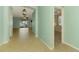 Open-concept living area with tile floors, neutral paint, and sliding glass doors to the lanai at 9022 Coachman Dr, Venice, FL 34293