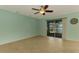 Bright open room with tile floor and sliding glass doors to a screened in porch at 9022 Coachman Dr, Venice, FL 34293
