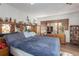 Comfortable bedroom featuring natural light and wood furnishings at 9625 Erie Rd, Parrish, FL 34219