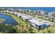 Stunning aerial view of condos with waterfront access, lush landscaping, and convenient parking at 1017 Tidewater Shores Loop # 1017, Bradenton, FL 34208