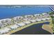 Aerial view of a waterfront condo community with a bridge and serene water views at 1017 Tidewater Shores Loop # 1017, Bradenton, FL 34208