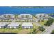 Beautiful waterfront condo community with lush landscaping, well-kept parking areas, and serene water views at 1017 Tidewater Shores Loop # 1017, Bradenton, FL 34208