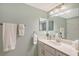 Bathroom featuring a beautiful mirror and white vanity at 1017 Tidewater Shores Loop # 1017, Bradenton, FL 34208