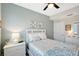 Bedroom featuring a ceiling fan, and a bed with decorative pillows at 1017 Tidewater Shores Loop # 1017, Bradenton, FL 34208