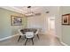 Tastefully designed dining area featuring a modern chandelier and tile floors leading to open floorplan at 1017 Tidewater Shores Loop # 1017, Bradenton, FL 34208