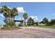 Luxurious gated entrance to Tidewater Preserve community, featuring brick pavers, lush landscaping, and grand architecture at 1017 Tidewater Shores Loop # 1017, Bradenton, FL 34208