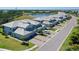 Beautiful townhome with a spacious two-car garage, landscaped lawn, and a community lake nearby at 1017 Tidewater Shores Loop # 1017, Bradenton, FL 34208