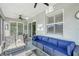 Serene screened-in lanai with outdoor seating, providing a tranquil space for relaxation and enjoyment of the surroundings at 1017 Tidewater Shores Loop # 1017, Bradenton, FL 34208