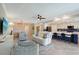Bright living area featuring modern furniture, ceiling fan, and an open layout flowing into the kitchen at 1017 Tidewater Shores Loop # 1017, Bradenton, FL 34208