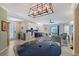 Spacious living room featuring an open floor plan, dining area, modern decor, and tile floors at 1017 Tidewater Shores Loop # 1017, Bradenton, FL 34208