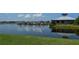 Gorgeous waterfront view of private boat docks, lake, and beautiful clubhouse at Tidewater Preserve in Bradenton, Florida at 1017 Tidewater Shores Loop # 1017, Bradenton, FL 34208