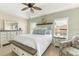Comfortable bedroom with neutral colors and lots of light at 10202 L Pavia Blvd # 10202, Venice, FL 34292