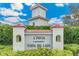 Attractive community sign surrounded by lush greenery at 10202 L Pavia Blvd # 10202, Venice, FL 34292