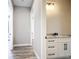Bathroom with a white vanity cabinet with a granite countertop and sleek fixtures at 10588 Kidron Ave, Englewood, FL 34224