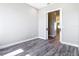 This bedroom features sleek wood flooring, and an open doorway to another room at 10588 Kidron Ave, Englewood, FL 34224