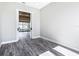 This bedroom features sleek wood flooring, and an open doorway to another room at 10588 Kidron Ave, Englewood, FL 34224