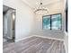 Dining area featuring stylish lighting, large window and vinyl flooring at 10588 Kidron Ave, Englewood, FL 34224