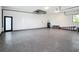 Clean and spacious garage featuring epoxy flooring and ample storage space at 10588 Kidron Ave, Englewood, FL 34224