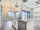 Modern kitchen island with granite countertops and stainless steel appliances at 10588 Kidron Ave, Englewood, FL 34224