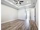 Spacious main bedroom with tray ceilings and vinyl flooring at 10588 Kidron Ave, Englewood, FL 34224