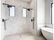 Expansive double shower with modern fixtures, rain shower heads, and marble surround at 10588 Kidron Ave, Englewood, FL 34224