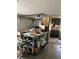 Cluttered garage with an automatic door opener at 11202 Tralee Dr, Riverview, FL 33569