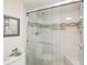Updated bathroom showcasing a glass shower door and decorative tile accents, combining style and functionality at 1170 Bird Bay Way # 206, Venice, FL 34285